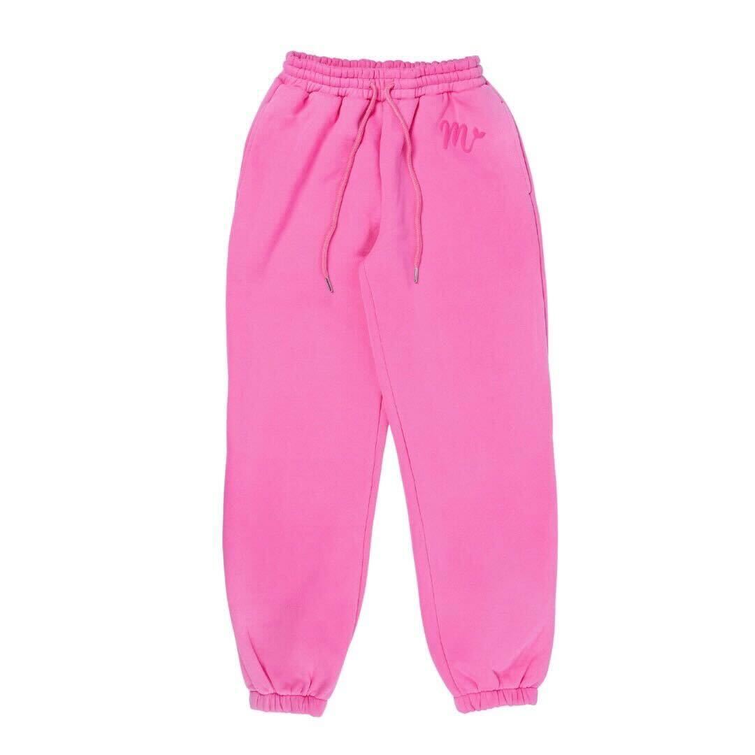 Bright pink sweatpants featuring an elastic waistband with adjustable drawstrings and cuffed ankles. The pants have a minimalist embossed logo on the left thigh, offering a stylish and comfortable fit, perfect for casual wear.